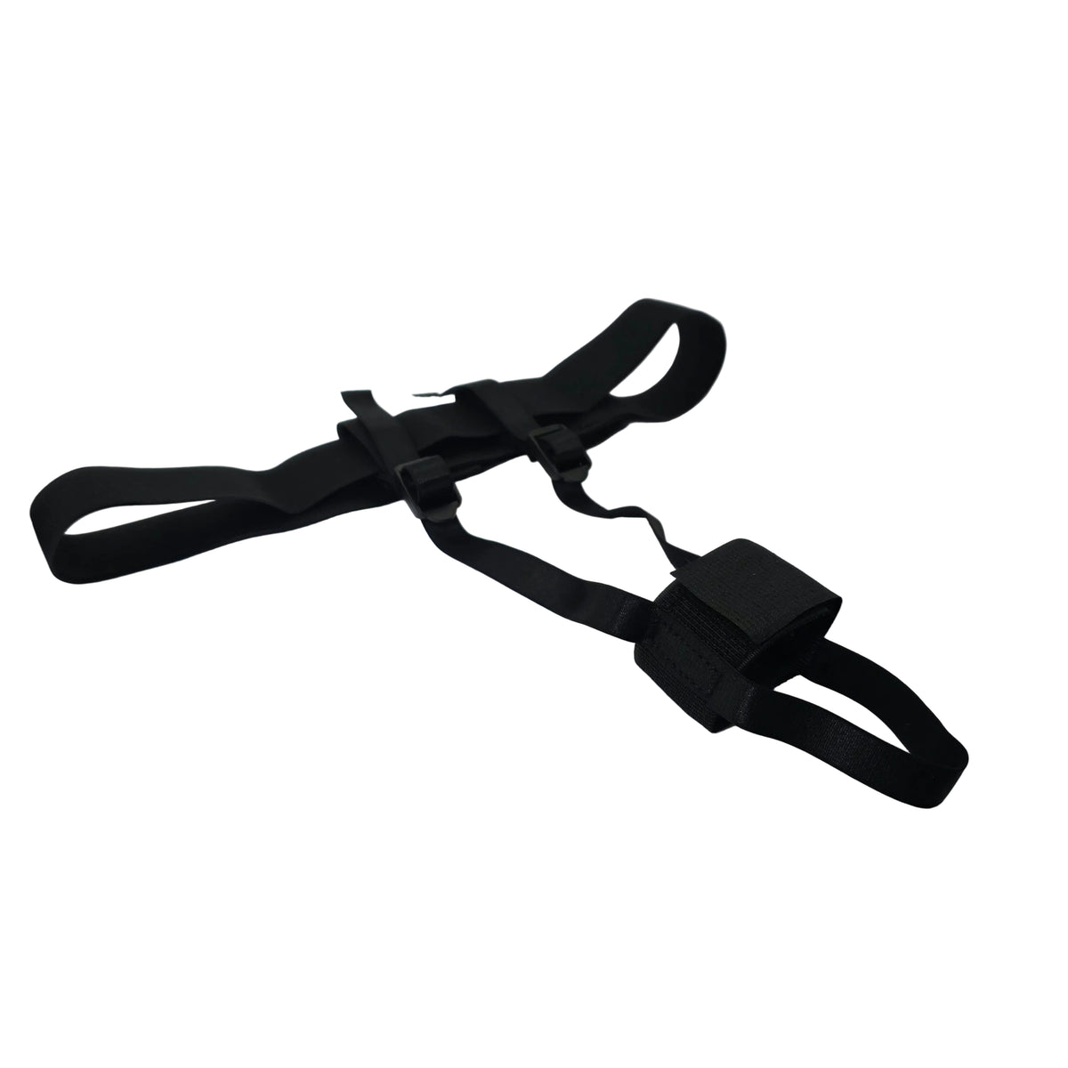 A black adjustable strap harness with a plastic buckle, laid out on a white satin fabric inside a white box.