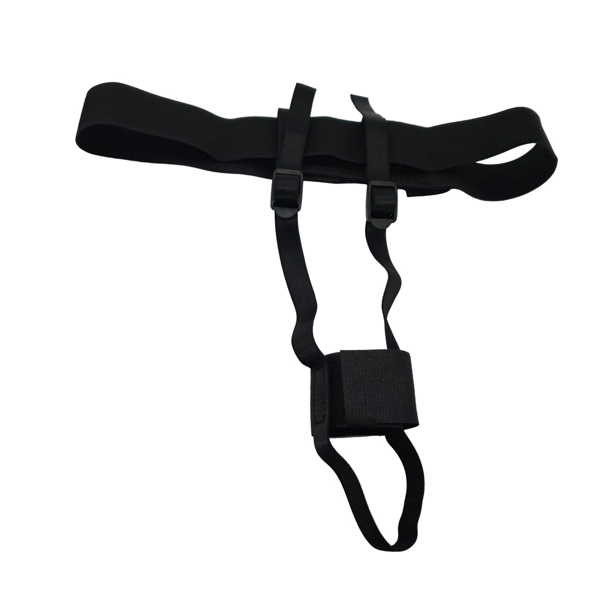 A black adjustable strap harness or support band with plastic buckles, laid flat on a white satin-like fabric surface.