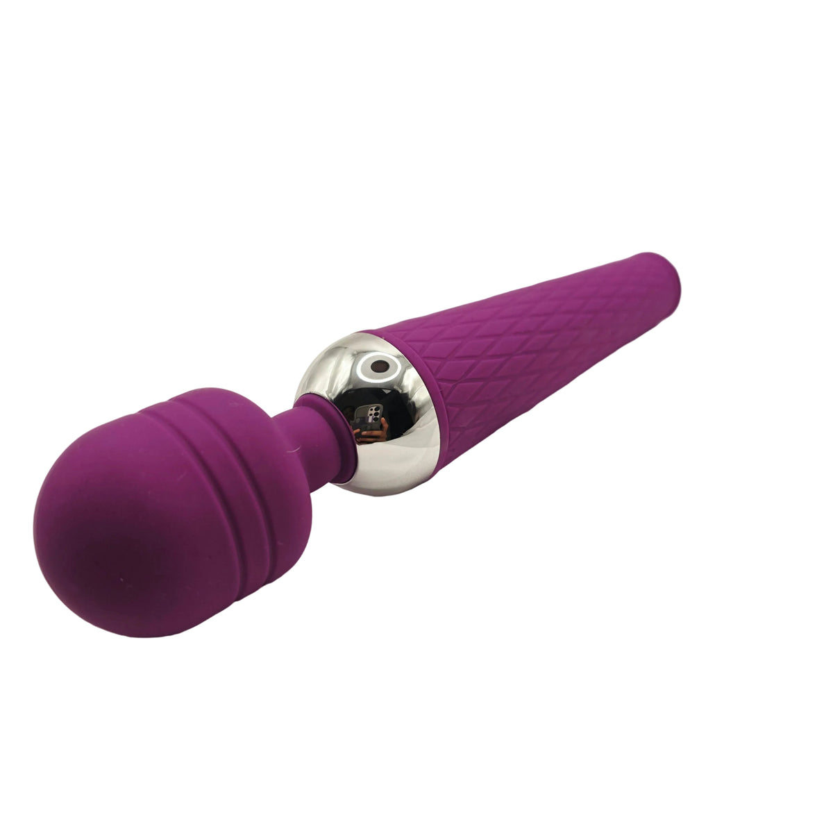 A purple and silver handheld personal massager with a textured handle and a smooth spherical head, resting on a white surface.