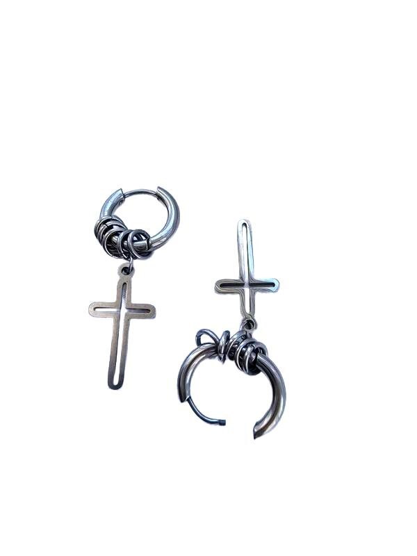 A pair of silver-toned metal earrings featuring a cross charm and a curved hook with wire wrapping, displayed on a solid white background.